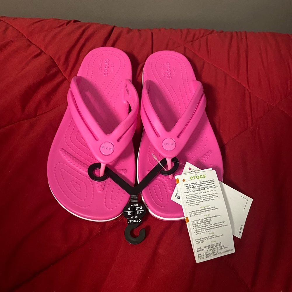 electric pink crocband flip flops